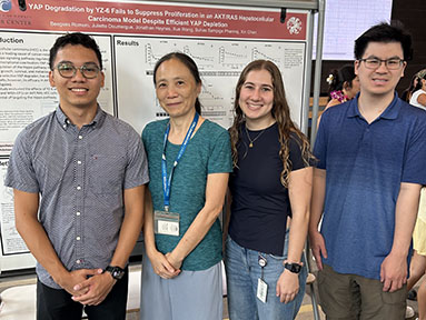 Beegees Romero during the CREATE Summer intern poster session with Chen lab members